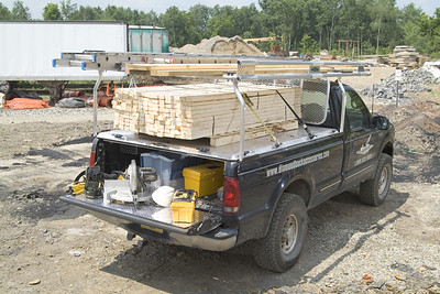 Truck with DiamondBack Truck Bed Cover, loaded with Lumber. Image Credit: DiamondBack Truck Covers