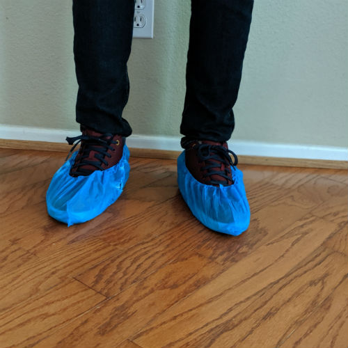 GoShare Delivery Pro with Blue Shoe Protectors on Feet